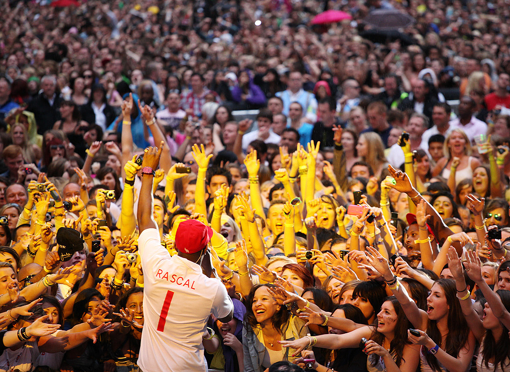 Dizzee Rascal embraces the crowd 
