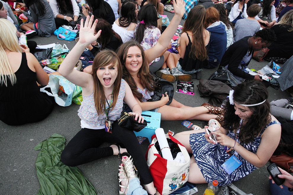 Fans wait for entry to the stadium